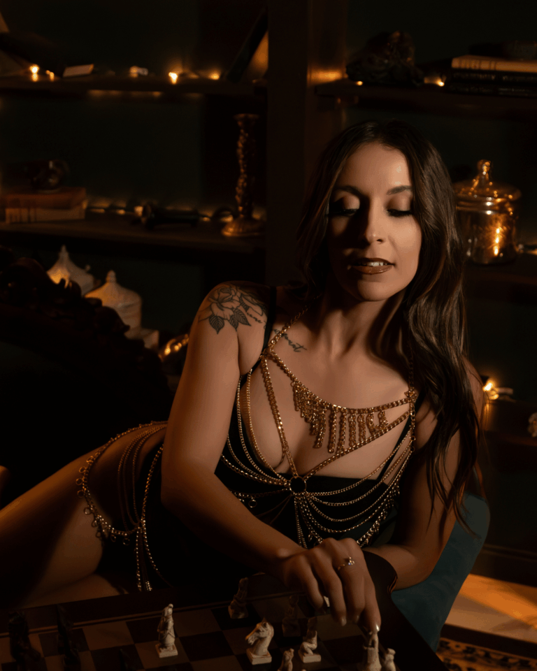Woman wearing decorative body chains during a luxury boudoir photography session in Evansville, Indiana.
