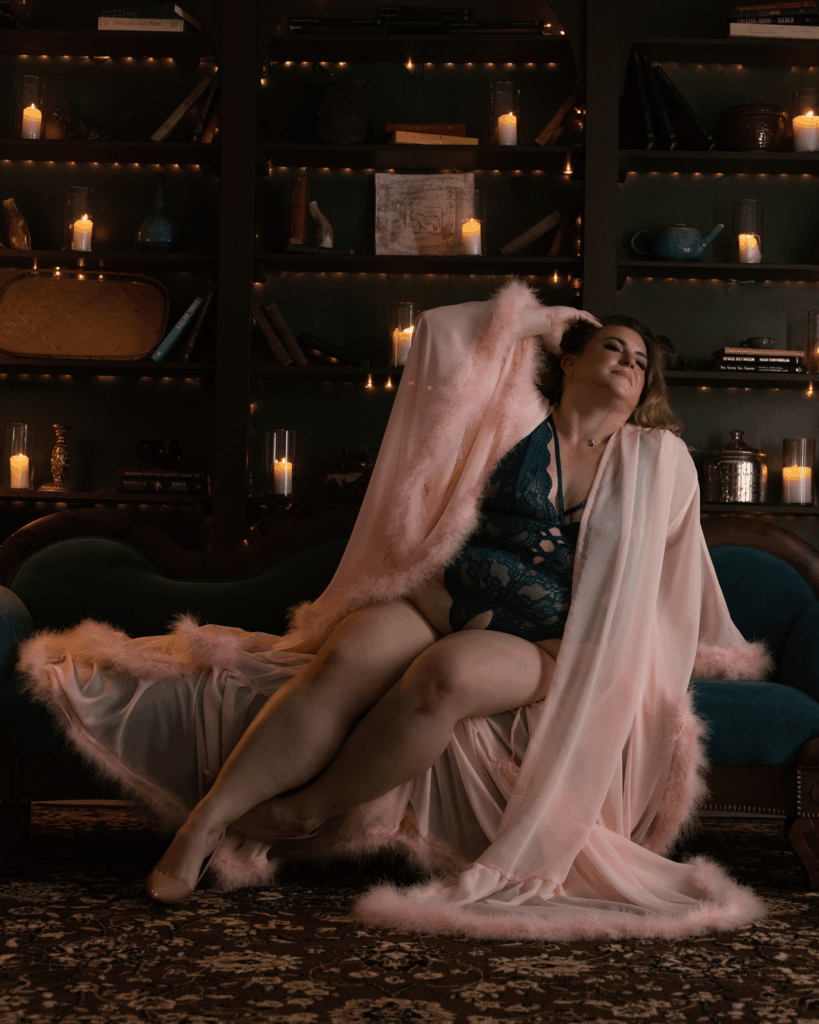 Woman wearing a flowing pink robe during a boudoir photography session in Evansville, Indiana.