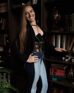 Smiling Evansville, Indiana boudoir photographer standing in her luxury photography studio.